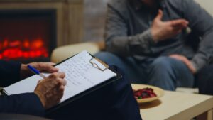 Close up of psychologist writing notes